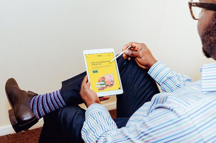 a man holding a tablet